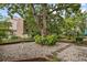 Charming home features mature trees, beautiful landscaping, a birdbath, and an inviting atmosphere at 308 76Th Ave. N # 5, Myrtle Beach, SC 29572