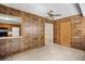 The living room offers tiled flooring, a ceiling fan, and an opening to the kitchen at 308 76Th Ave. N # 5, Myrtle Beach, SC 29572