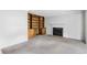 Living room featuring a fireplace, and built-in wooden shelving unit at 308 76Th Ave. N # 5, Myrtle Beach, SC 29572