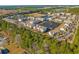 Wide aerial view of a residential community featuring multiple ponds, lush landscaping, and trees at 340 Kiskadee Loop, Conway, SC 29526
