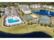 Aerial view of community amenities featuring a pool, basketball court, volleyball court, and ponds at 340 Kiskadee Loop, Conway, SC 29526