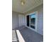 View of the balcony with open sliding door and closed side door at 340 Kiskadee Loop, Conway, SC 29526