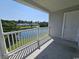 Balcony area view overlooks pond and neighboring townhomes and offers a calming outdoor experience at 340 Kiskadee Loop, Conway, SC 29526
