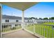 View from a balcony overlooking a pond and other condo buildings within the community at 340 Kiskadee Loop, Conway, SC 29526
