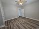 Comfortable bedroom features a ceiling fan, wood-look flooring, neutral wall paint, and bright white trim at 340 Kiskadee Loop, Conway, SC 29526