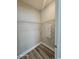 Walk-in closet featuring a wire shelving system, neutral wall color, and modern wood-look flooring at 340 Kiskadee Loop, Conway, SC 29526