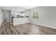 Spacious living room featuring a view of the kitchen, wood flooring, and natural light at 340 Kiskadee Loop, Conway, SC 29526