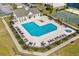 Aerial view of community pool with lounge chairs, tables, umbrellas and landscaped surroundings at 340 Kiskadee Loop, Conway, SC 29526