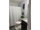 Cozy bathroom with a shower curtain and a modern vanity with granite counters at 387 Blue Rock Dr., Longs, SC 29568