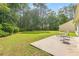 Spacious backyard with lush lawn, bordered by mature trees and landscaping, perfect for entertaining at 396 Mckendree Ln., Myrtle Beach, SC 29579