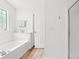 Bright bathroom featuring a soaking tub, glass shower and stylish fixtures at 396 Mckendree Ln., Myrtle Beach, SC 29579