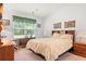 Cozy bedroom with a window, soft lighting, and neutral decor at 396 Mckendree Ln., Myrtle Beach, SC 29579