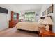 A cozy bedroom with carpet flooring, a window and comfortable furnishings at 396 Mckendree Ln., Myrtle Beach, SC 29579