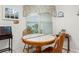 Cozy breakfast nook with a wooden table and chairs by a bright window at 396 Mckendree Ln., Myrtle Beach, SC 29579