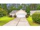Charming single-story home with a well-maintained lawn and driveway, creating a welcoming curb appeal at 396 Mckendree Ln., Myrtle Beach, SC 29579