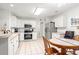 Bright kitchen with white cabinets, stainless steel appliances, and a breakfast nook at 396 Mckendree Ln., Myrtle Beach, SC 29579