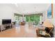 Bright living room featuring a vaulted ceiling, hardwood floors, and sliding glass doors to the backyard at 396 Mckendree Ln., Myrtle Beach, SC 29579