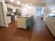 Bright kitchen featuring stainless steel appliances, tile backsplash, and an island with seating at 401 Quinta St., Longs, SC 29568