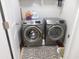 Efficient laundry space with front-load washer and dryer set on a patterned rug at 401 Quinta St., Longs, SC 29568