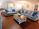 Cozy living room with hardwood floors, comfortable seating, and natural light at 401 Quinta St., Longs, SC 29568