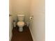 Powder room features a standard toilet with wood-look flooring and neutral wall color at 401 Quinta St., Longs, SC 29568