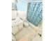 Cozy bathroom featuring a hexagon tile floor, single sink vanity, and shower with patterned curtain at 403 6Th Ave. S, Myrtle Beach, SC 29577