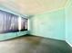 This bedroom features a brick accent wall and natural light from a large window at 403 6Th Ave. S, Myrtle Beach, SC 29577