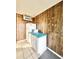 A simple kitchenette with white cabinets and a compact refrigerator and microwave at 403 6Th Ave. S, Myrtle Beach, SC 29577