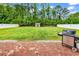 Large backyard with privacy fence, shed, green grass, and brick patio at 408 Carmello Circle, Conway, SC 29526