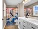 Bathroom with a double sink vanity and a fun dinosaur-themed shower curtain at 408 Carmello Circle, Conway, SC 29526