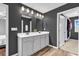 This bathroom features a double sink vanity, neutral paint, and a walk-in closet at 408 Carmello Circle, Conway, SC 29526