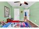 Bright bedroom featuring cheerful Mario Brothers-themed bedding and ceiling fan at 408 Carmello Circle, Conway, SC 29526