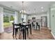 Bright eat-in kitchen featuring stainless steel appliances, granite countertops, and a sliding glass door to the patio at 408 Carmello Circle, Conway, SC 29526