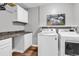 Bright laundry room with washer, dryer, countertops and ample storage space at 408 Carmello Circle, Conway, SC 29526