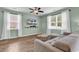 Comfortable living room with large windows, light walls, and a modern ceiling fan at 408 Carmello Circle, Conway, SC 29526