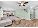 Cozy living room leading to the kitchen and staircase, filled with natural light and neutral decor at 408 Carmello Circle, Conway, SC 29526