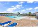 Inviting community pool area featuring ample lounge chairs and clear blue water for relaxation at 408 Carmello Circle, Conway, SC 29526