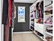 Walk-in closet with neutral paint and closet organizers for ample storage at 408 Carmello Circle, Conway, SC 29526