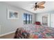 Bright bedroom with ocean view, ceiling fan, and adjacent bathroom at 4103 N Ocean Blvd. # 707, North Myrtle Beach, SC 29582