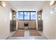Elevator lobby with elevators on either side of a bright window at 4103 N Ocean Blvd. # 707, North Myrtle Beach, SC 29582