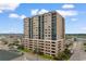 Multi-story condominium building featuring multiple balconies offering views of the surrounding coastal landscape at 4103 N Ocean Blvd. # 707, North Myrtle Beach, SC 29582