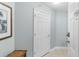 Inviting condo hallway with neutral paint, tiled floor, and closed front door at 4103 N Ocean Blvd. # 707, North Myrtle Beach, SC 29582