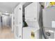 Stacked washer and dryer with adjacent water heater in hallway location at 4103 N Ocean Blvd. # 707, North Myrtle Beach, SC 29582
