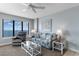 Comfortable living room with ocean view, ceiling fan, stylish furniture, and coastal decor at 4103 N Ocean Blvd. # 707, North Myrtle Beach, SC 29582
