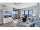 Inviting living room with ocean views, entertainment center, balcony access, and comfortable seating at 4103 N Ocean Blvd. # 707, North Myrtle Beach, SC 29582
