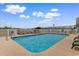 Outdoor pool with lounge chairs offers a place to relax and enjoy the ocean breeze at 4103 N Ocean Blvd. # 707, North Myrtle Beach, SC 29582