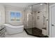 Elegant bathroom features soaking tub, and glass-enclosed shower at 433 Saint Julian Ln., Myrtle Beach, SC 29579