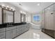 Elegant bathroom features double vanity, soaking tub, and glass-enclosed shower at 433 Saint Julian Ln., Myrtle Beach, SC 29579