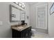 Bathroom features a black vanity with granite countertops and a large mirror at 433 Saint Julian Ln., Myrtle Beach, SC 29579