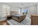Bright bedroom boasts a king bed, neutral rug and access to an outdoor patio at 433 Saint Julian Ln., Myrtle Beach, SC 29579